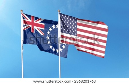 American flag and Cook Islands flag waving under cloudy sky. flying in the sky