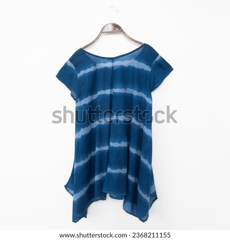 Woman blouse with Dry indigo blue on white background.