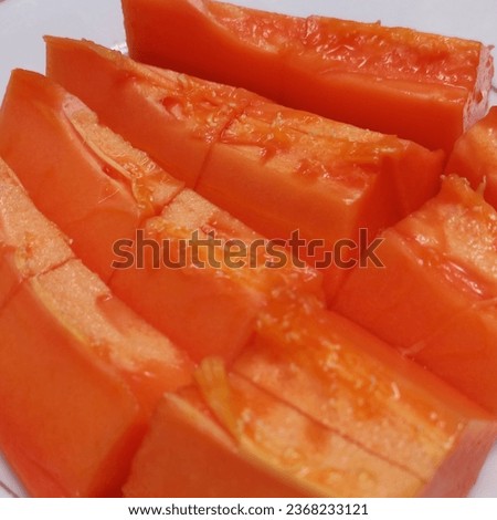 Fresh Papaya Slice Or Pepaya From Indonesia | close up tropical fruits with sweet flavor stock photos