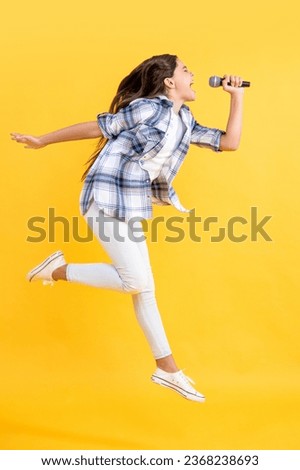 teen girl having fun. teen music singer. music lifestyle. sing a music song. young singer singing in mic. teen girl having fun at karaoke. girl singing karaoke with microphone. childhood happiness Royalty-Free Stock Photo #2368238693