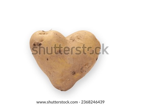 Organic potato shaped like a heart on a white background.