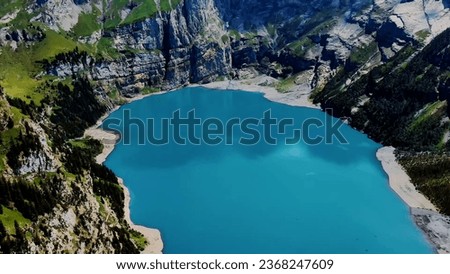 Top Destinations in Switzerland: Lake Oeschinen, Intimate Perspectives, Aerial Exploration, Scenic Vistas, Picture-Perfect Photography, Tourist Haven, Idyllic Scenes, Harmony of Nature and Architectur