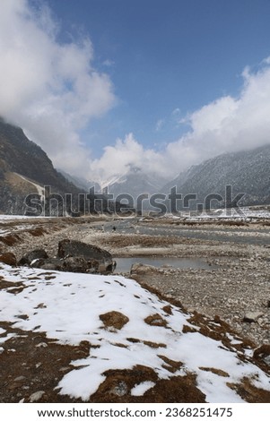 Yumthang valley. Frozen mountain portrait picture. Mountain river. 