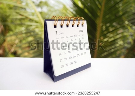 January 2024 - A small desktop calendar January 2024 with nature background, time and business concept.