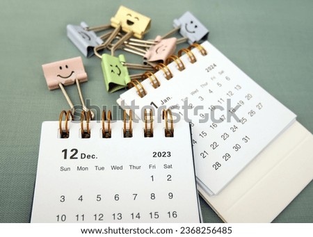 January 2024 and December 2023- Closeup of a small desktop calendar with cute paperclips, time and business concept Royalty-Free Stock Photo #2368256485