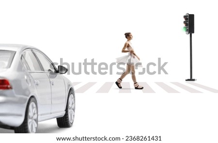 Ballerina carrying toe shoes and crossing a street at pedestrian zerba isolated on white background