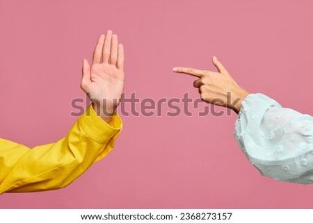 Two hands showing palm, index finger, pointing isolated on pastel pink color background. Sign of partnership, friendship, deal, nonverbal, communication. Feelings and emotions concept. Poster. Ad Royalty-Free Stock Photo #2368273157