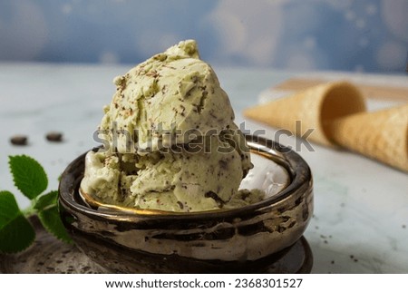 
Healthy homemade mint ice cream. A delicious and tasty cold dessert. Mint refreshment. Summer dessert.
