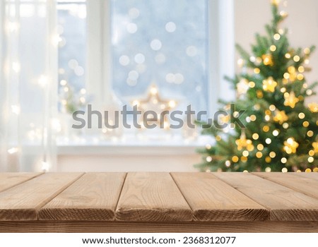 Empty table in front of christmas tree with decoration background Royalty-Free Stock Photo #2368312077