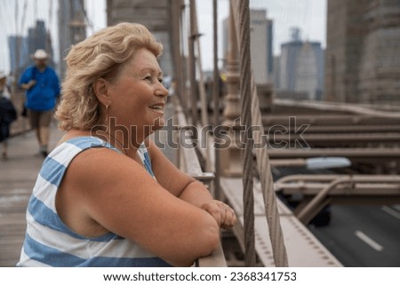 Elderly Woman Strolling Through New York with a Stunning Manhattan View