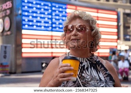 Elegantly Dressed Senior Lady Enjoying a Shopping Day in New York Royalty-Free Stock Photo #2368347325