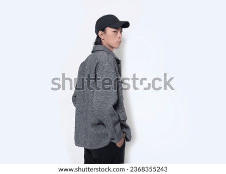 portrait of handsome male wearing hat,jacket posing on white background Royalty-Free Stock Photo #2368355243