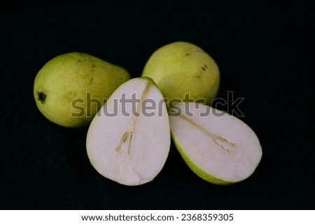 Fresh pear cut on half.