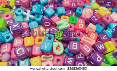 Green Smile Face among alphabets beads