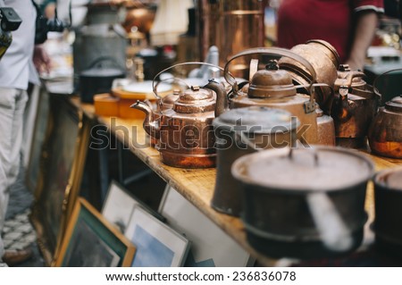antique pans and pots at the street market in sweden Royalty-Free Stock Photo #236836078