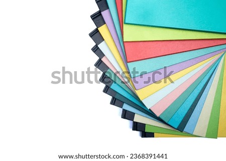 pile of thin books, colorful stair composition