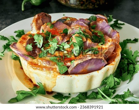 Sweet potatoes in the shape of a rose with meat and cheese on white plate. Potatoes cooked in shape of a flower. Japanese cuisine Royalty-Free Stock Photo #2368391921