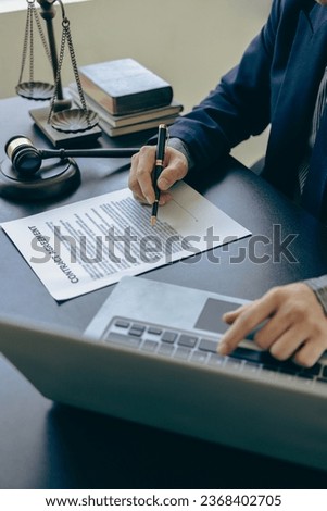 Judge hammer with judge, lawyer, businessman in suit working on legal documents in courtroom, justice and law, lawyer, judge, court concept vertical picture