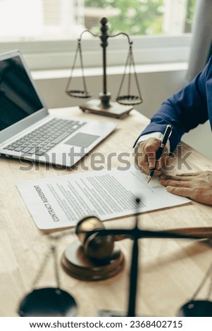 Judge hammer with judge, lawyer, businessman in suit working on legal documents in courtroom, justice and law, lawyer, judge, court concept vertical picture