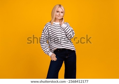 Photo of gorgeous nice middle aged lady model on fashion week wear new clothes posing isolated bright color background