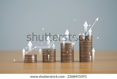 stack of silver coins with trading chart in financial concepts and financial investment business stock growth, for financial banking increase interest rate. Royalty-Free Stock Photo #2368415591