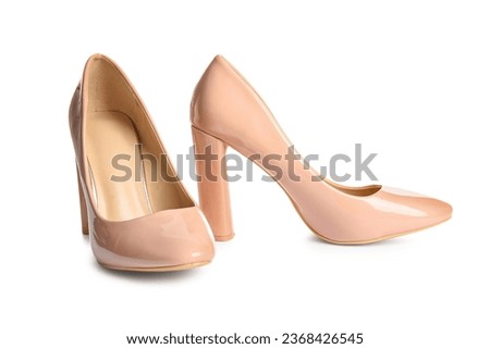 Pair of beige high heeled shoes on white background Royalty-Free Stock Photo #2368426545