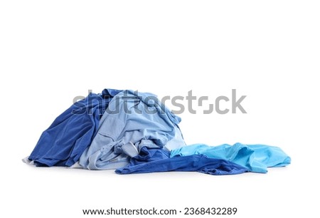 Heap of dirty blue clothes on white background Royalty-Free Stock Photo #2368432289