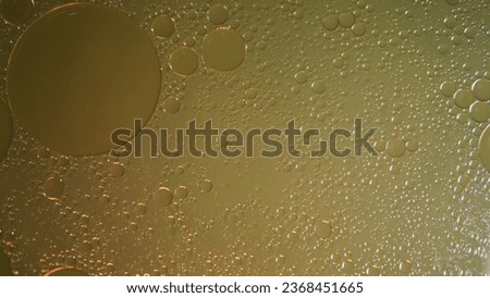 nice background, abstract background of oil bubbles on water with orange light