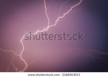 Electricity Dancing Across Dramatic Storm Sky. A dramatic, stormy night with forked lightning and warning sign.