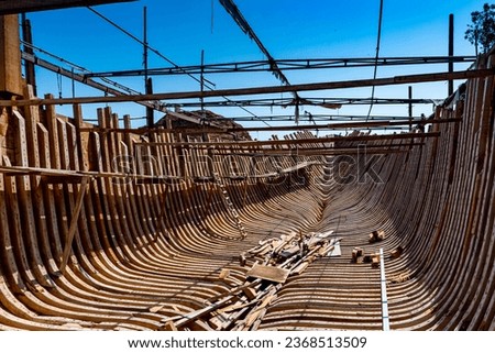 Interior view of traditional wooden dhow boat in Sur, Oman.  Royalty-Free Stock Photo #2368513509
