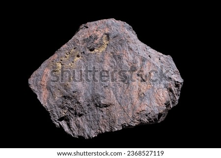 An isolated meteorite with black background.