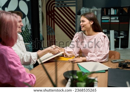 Client thanks the consultant manager with a handshake Royalty-Free Stock Photo #2368535265