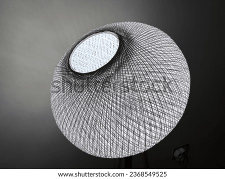 lampshade. floor lamp home lighting system. night light. white light to illuminate the room. white rope. room living room kitchen. Home decor tool with wooden legs.