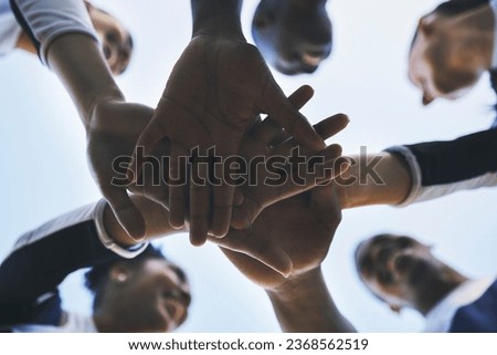 Cheerleader, hands or people in huddle for motivation with support, hope or goal in game on field. Teamwork, low angle or group of sports athletes cheerleaders with pride, plan or solidarity together