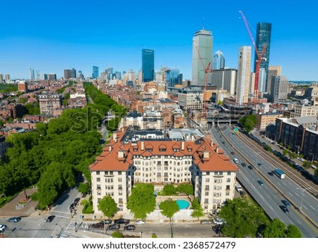 Historic apartment building at Commonwealth Avenue with Boston Back Bay modern skyline including John Hancock Tower, Prudential Tower, and One Dalton Street in Boston, Massachusetts MA, USA.  