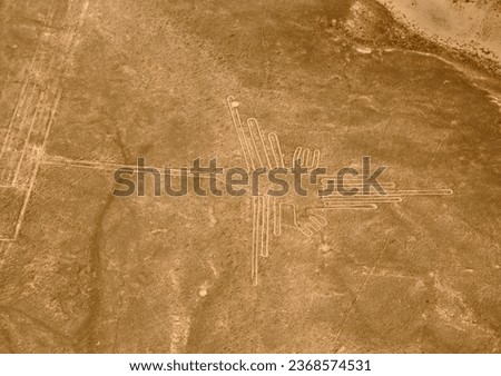 Condor, Nazca Lines Aerial: An aerial shot capturing the majestic Condor figure, a marvel of Nazca's ancient artistry. Royalty-Free Stock Photo #2368574531