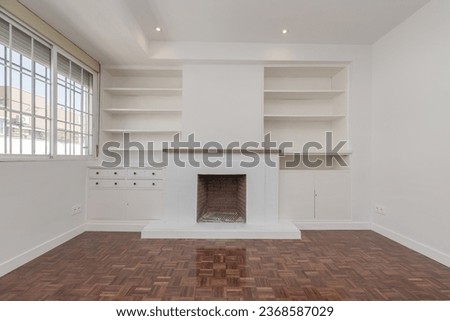 Living room in apartment with built-in fireplace
