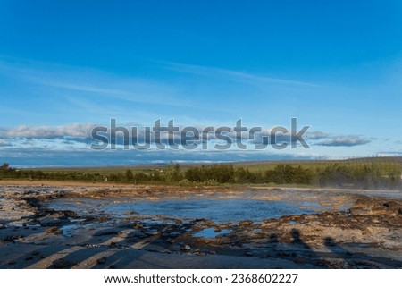 Strokkur, a fountain-type geyser located in a geothermal area beside the Hvítá River, southwestern Iceland, east of Reykjavík. It typically erupts every 6–10 minutes. Part of The Golden Circle Tour. Royalty-Free Stock Photo #2368602227