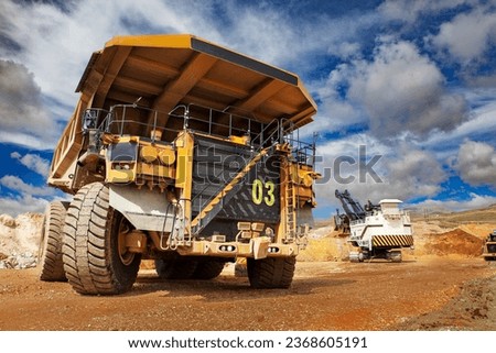 Mining trucks are among the largest vehicles in the world. They come in various sizes, with payload capacities ranging from 30 tons to over 400 tons Royalty-Free Stock Photo #2368605191
