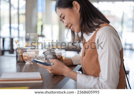 Close up of customer writing reviews, hand pressing on a smartphone screen with a golden five star rating feedback icon. Concept of rating and feedback for evaluation