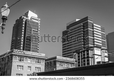 Black and white image of two tall buildings in downtown Portland Oregon