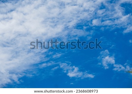 White cumulus cloudy blue sky background. 