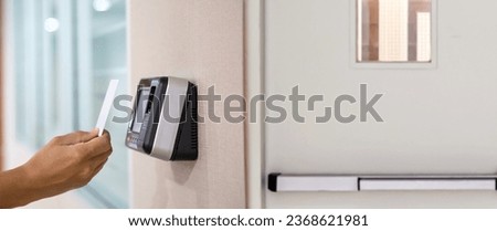 Proximity card door unlock, Hand security man using fingerprint scan on ID card reader access control system for identity verification to open the door or for security safety or check attendance. Royalty-Free Stock Photo #2368621981