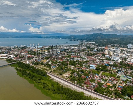 Coastline City with modern buildings and highway of Cagayan de Oro in Mindanao, Philippines.