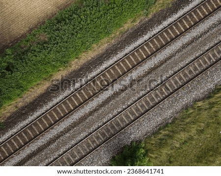 Railroad tracks in the landscape  Royalty-Free Stock Photo #2368641741
