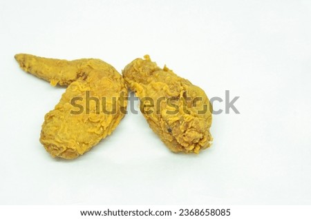 Fried chicken wings golden brown on white background.