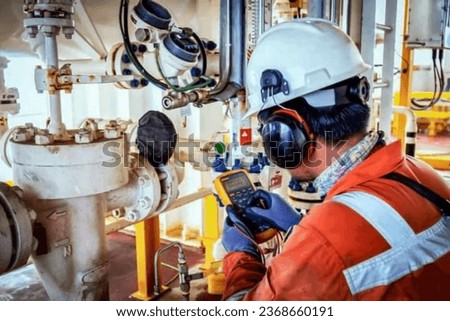 Technician,Instrument technician on the job calibrate or function check on instrument device or level transmitter in oil and gas platform offshore. Royalty-Free Stock Photo #2368660191