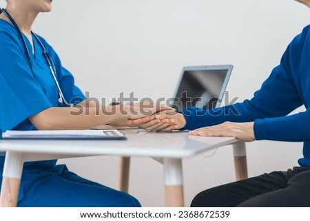 comfort, encourage, Asian people experienced female doctor giving advice to elderly male patient cancer and x-ray results and treatment options, Cancer Consultation, holding hands