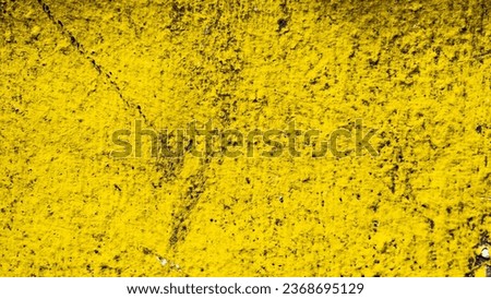 Yellow texture wallpaper photo that turns out to be a wall with added detail and color saturation