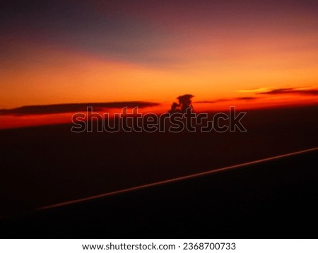 View of Sunset photo from airplane 